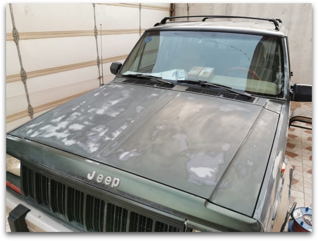 Faded 1996 Jeep Cherokee Country