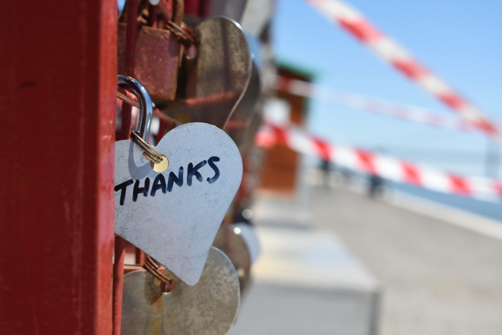 silver heart lock on bridge